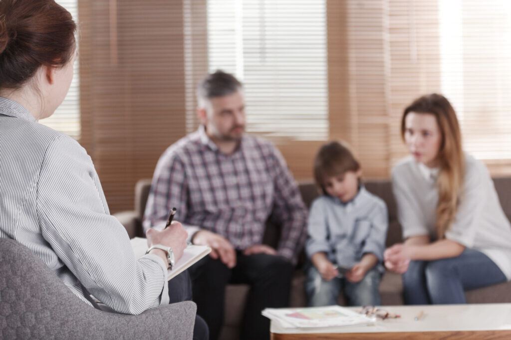 family speaking with a professional